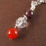 Full view of Aries zodiac necklace with natural gemstones.