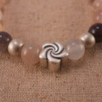 Close-up of aventurine bracelet with S925 silver accent beads.