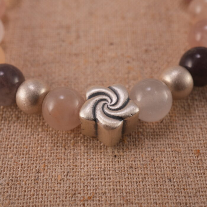 Close-up of aventurine bracelet with S925 silver accent beads.