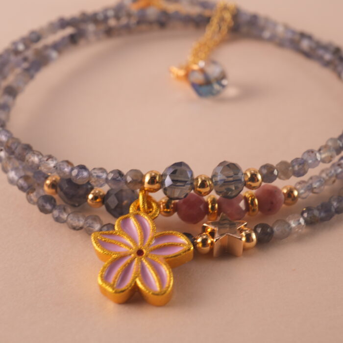 Close-up of the gemstone textures and metallic clasp.