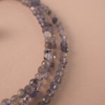 Close-up of the gemstone textures and metallic clasp.