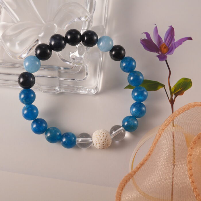 Bracelet in natural light with cool and dark gemstone tones.