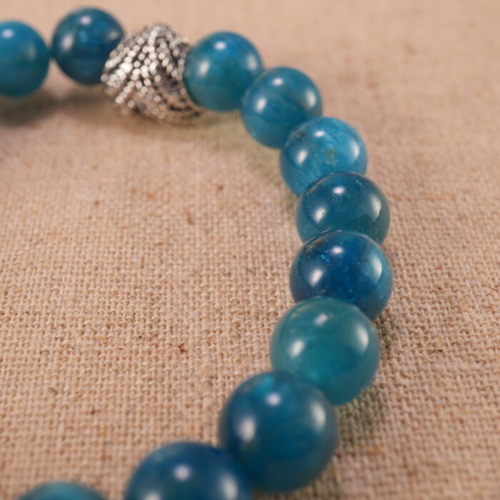 Close-up of blue apatite bracelet with S925 silver details.