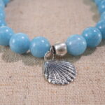 Close-up of blue chalcedony bracelet with soft sky-blue translucent beads.