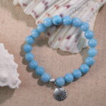 Blue chalcedony bracelet displayed in natural light with subtle background.
