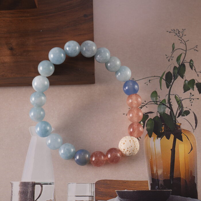 Bracelet in daylight with soft blue and pink gemstone tones.