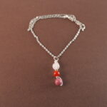 Cancer zodiac necklace with clear quartz, red agate, and rhodochrosite gemstones.