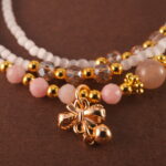 Macro shot of the Cat's Eye and Rhodochrosite beads with silver accents.