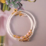 Full-length image of the necklace laid flat to reveal the bead pattern.