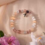 Bracelet in soft daylight with pastel pink and shimmer.