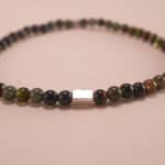 Close-up of dark tourmaline bracelet with silver.