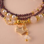 Close-up of polished Garnet beads, revealing their natural clarity and deep red luster.