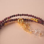 Close-up of polished Garnet beads, revealing their natural clarity and deep red luster.
