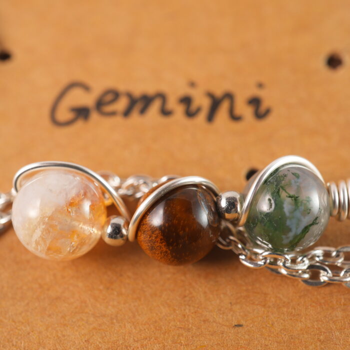 Close-up of Gemini necklace showing moss agate, tiger eye, and citrine beads.