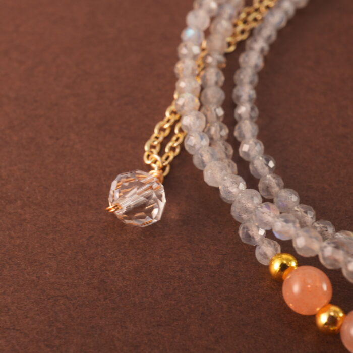 Close-up of the moonstone and quartz beads, revealing their natural shimmer and polished surfaces.