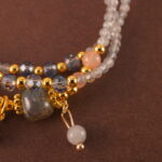 Close-up of the moonstone and quartz beads, revealing their natural shimmer and polished surfaces.