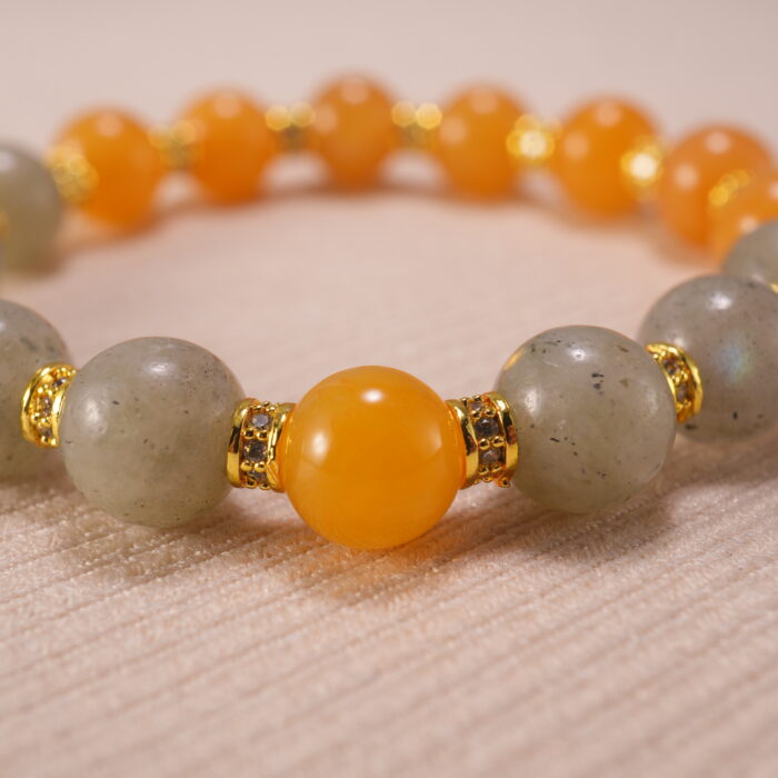 Close-up of gray moonstone and yellow chalcedony bracelet.