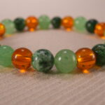 Close-up of green aventurine and citrine bracelet.