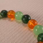 Close-up of green aventurine and citrine bracelet.