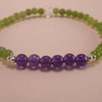 Close-up of green chalcedony and amethyst bracelet with silver.