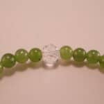 Close-up of green chalcedony and amethyst bracelet with silver.