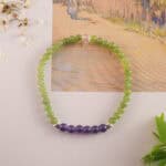 Bracelet in natural light showing soft green and violet hues.