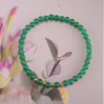 Bracelet in soft daylight showing fresh green tone.
