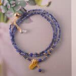 Unfolded view of the bracelet styled as a necklace, emphasizing its dual-wear design and gemstone arrangement.