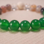 Detailed view of textured lava beads paired with polished agate and quartz – highlighting the bracelet's natural materials.