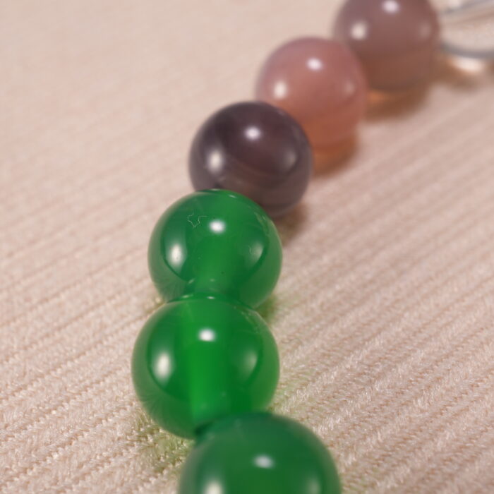 Detailed view of textured lava beads paired with polished agate and quartz – highlighting the bracelet's natural materials.
