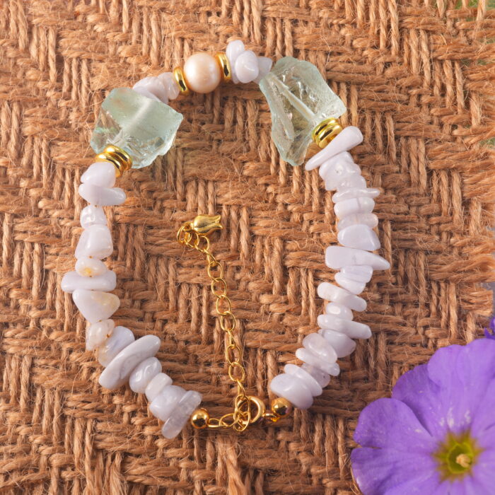 Full view of the bracelet highlighting Blue Lace Agate's soft patterns and the luminous shine of pearl and aquamarine.
