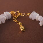 Close-up of the delicate textures in Blue Lace Agate and the refined finish of pearl and aquamarine beads.