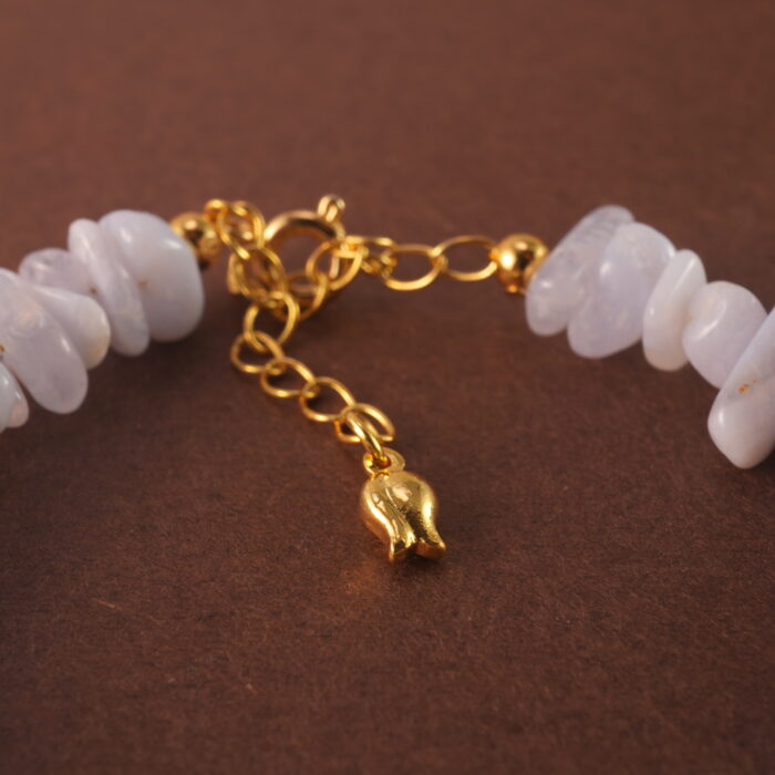 Close-up of the delicate textures in Blue Lace Agate and the refined finish of pearl and aquamarine beads.