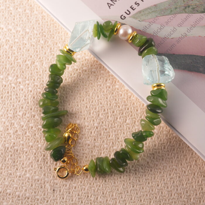 Full view of the bracelet highlighting the natural sheen of jade, soft luster of pearl, and cool clarity of aquamarine.