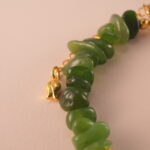 Close-up of jade, pearl, and aquamarine beads showing their natural textures and high-quality craftsmanship.