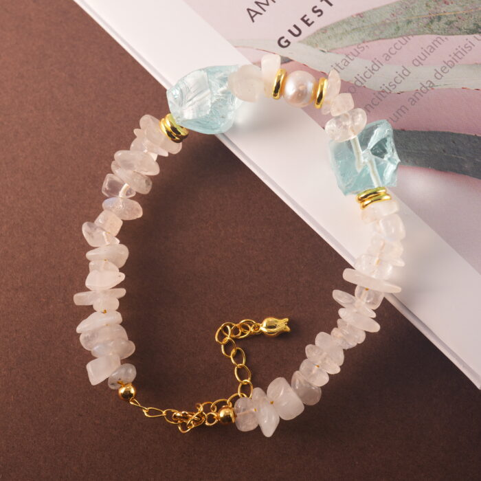 Full bracelet view highlighting the natural shimmer of moonstone, soft pearl glow, and aquamarine’s cool tone.
