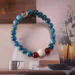 Detailed view highlighting the contrast between fiery red agate and cool blue fluorite.