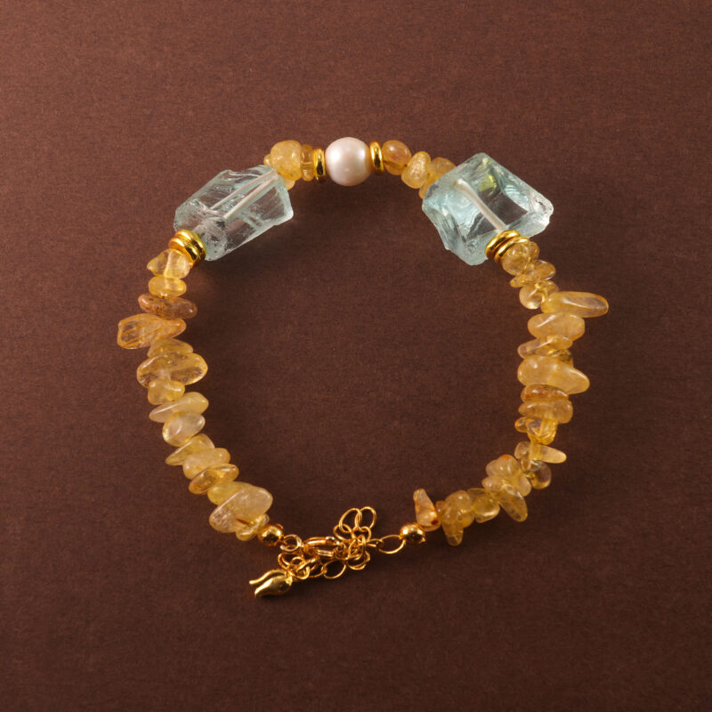 Handmade Libra bracelet featuring golden rutilated quartz, pearl, and aquamarine beads in a clean, elegant style.