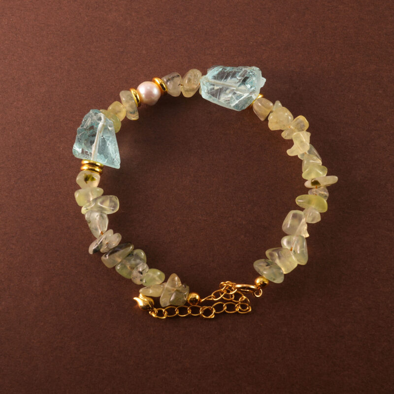 Handmade Pisces bracelet featuring aquamarine, pearl, and prehnite beads in a serene, zodiac-themed design.