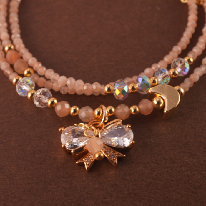 Close-up of rose quartz beads, showcasing their smooth texture and natural pink tone.