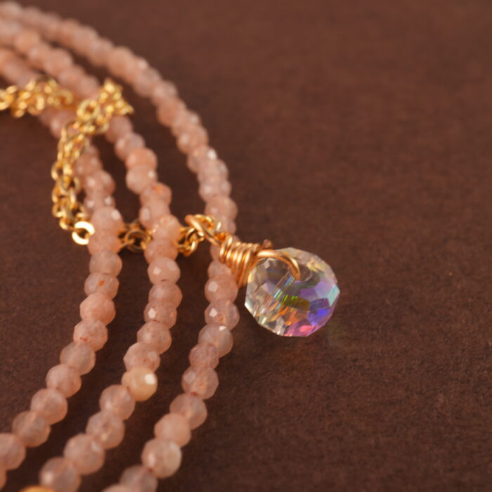 Close-up of rose quartz beads, showcasing their smooth texture and natural pink tone.