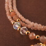 Close-up of rose quartz beads, showcasing their smooth texture and natural pink tone.