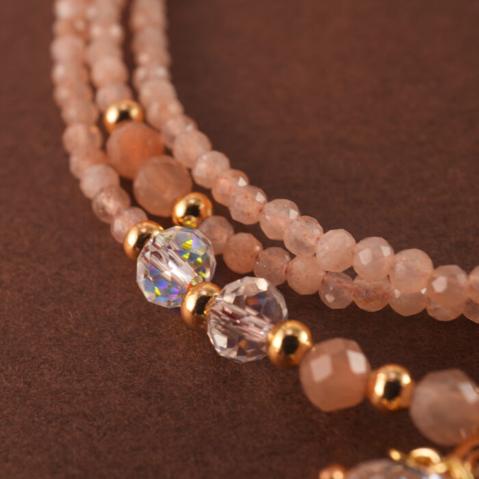 Close-up of rose quartz beads, showcasing their smooth texture and natural pink tone.