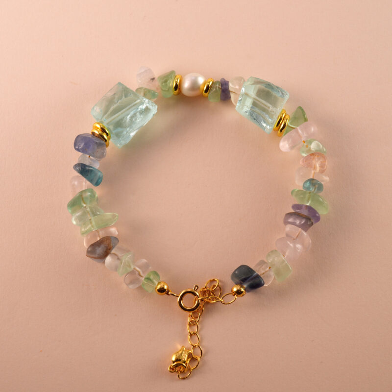 Front-facing view of the Sagittarius bracelet featuring fluorite, pearl, and aquamarine beads arranged in a calming celestial style.
