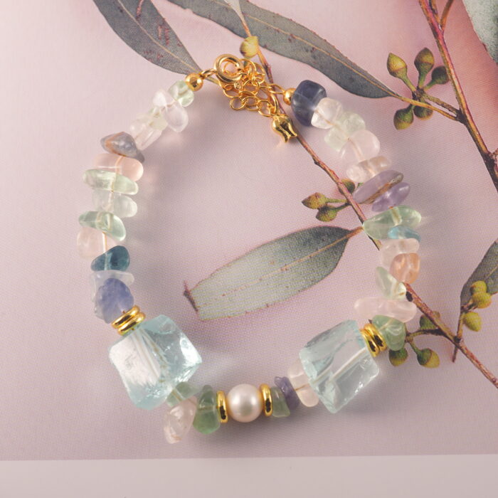 Full bracelet layout highlighting the balance between fluorite, pearl, and aquamarine beads.