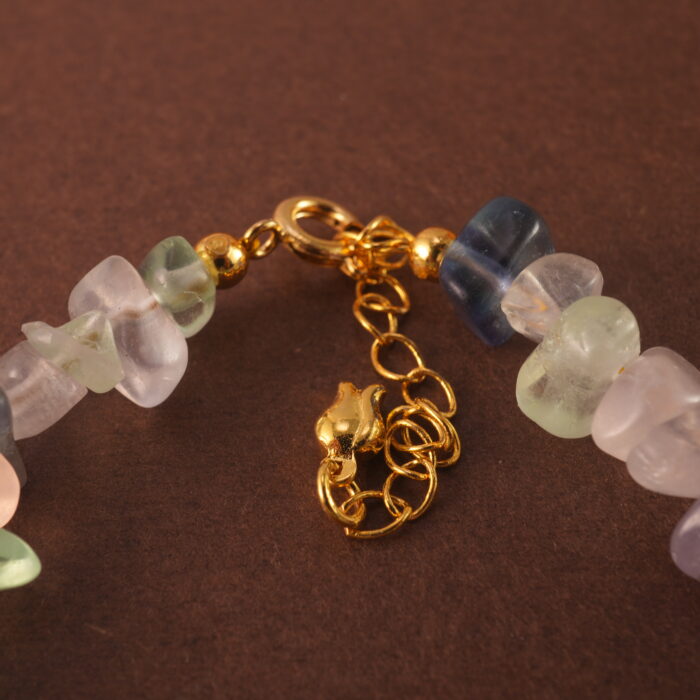 Detailed view of the Sagittarius bracelet highlighting the natural textures and subtle glow of fluorite, pearl, and aquamarine stones.