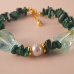 Close-up of the Scorpio bracelet highlighting the fine polish and unique patterns of malachite, pearl, and aquamarine.