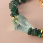 Close-up of the Scorpio bracelet highlighting the fine polish and unique patterns of malachite, pearl, and aquamarine.
