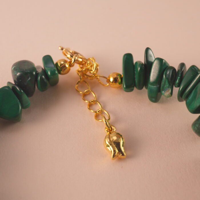 Close-up of the Scorpio bracelet highlighting the fine polish and unique patterns of malachite, pearl, and aquamarine.