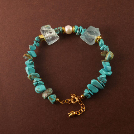 Handmade Taurus bracelet featuring turquoise, pearl, and aquamarine in a balanced, elegant design.